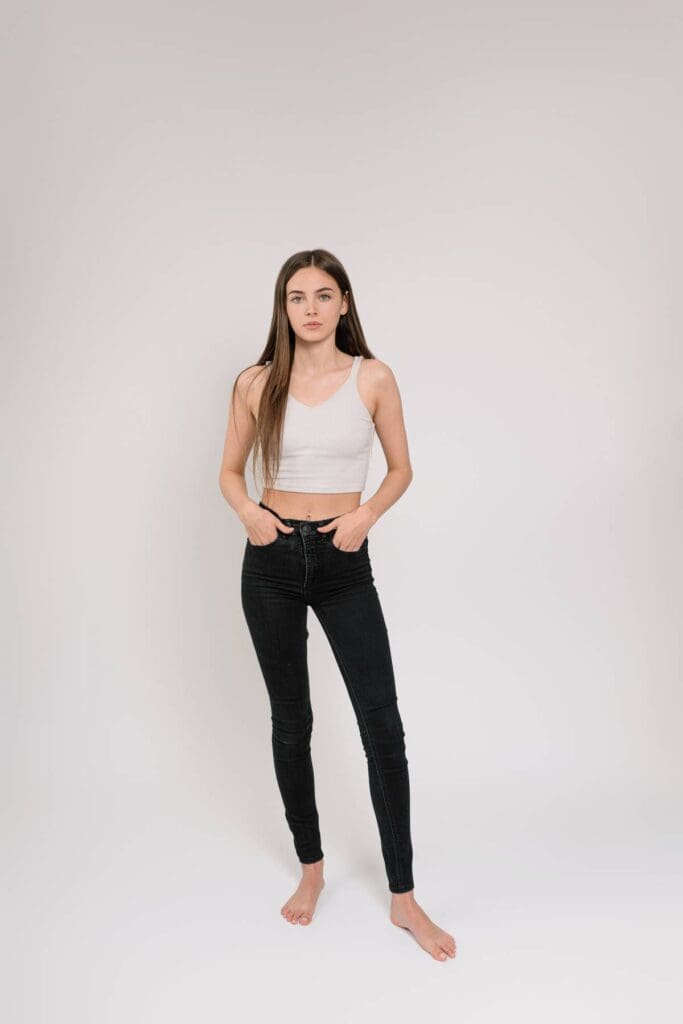 Full-body headshot in a black top, taken in the studio, highlighting a sleek and polished look, perfect for commercial and editorial modeling.
