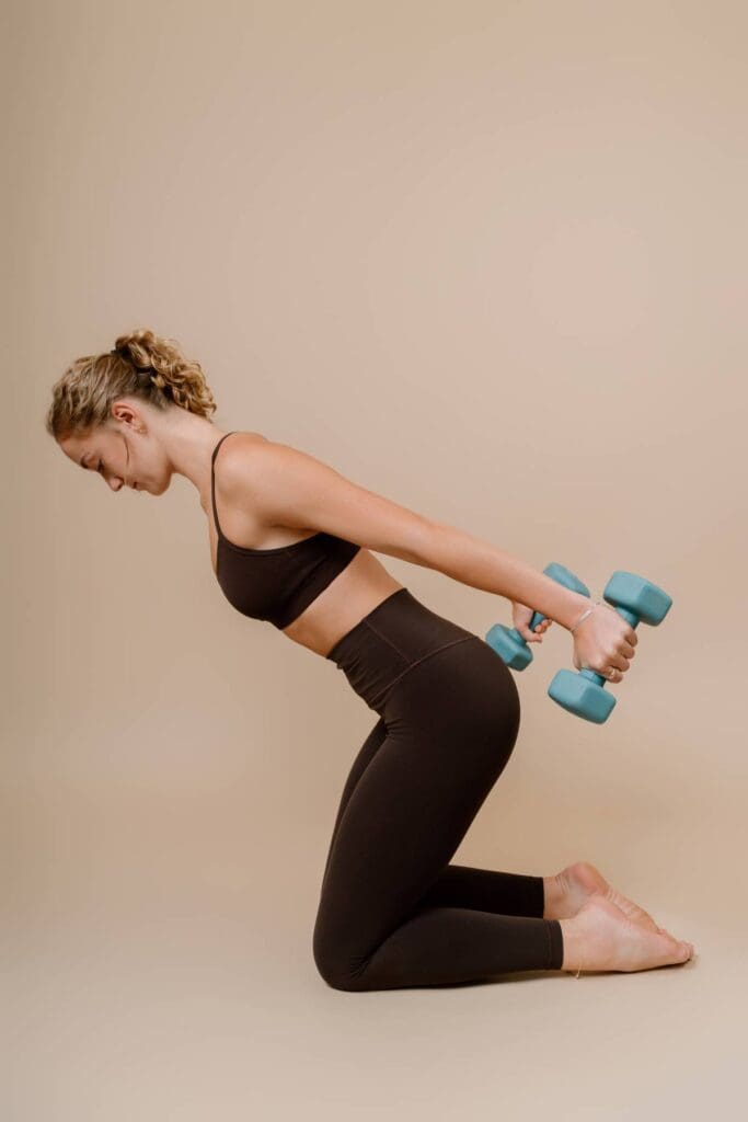 client doing an exercise with dumbells