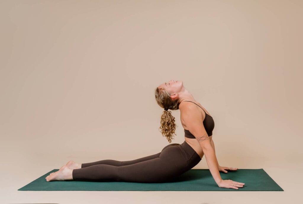yoga instructor doing pose on photography backdrop