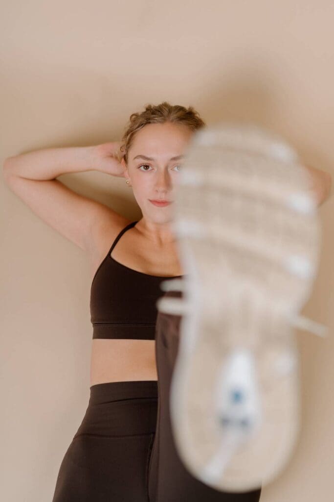 close up shot of client doing ab excervise but the focus is on them through the bottom of her shoe