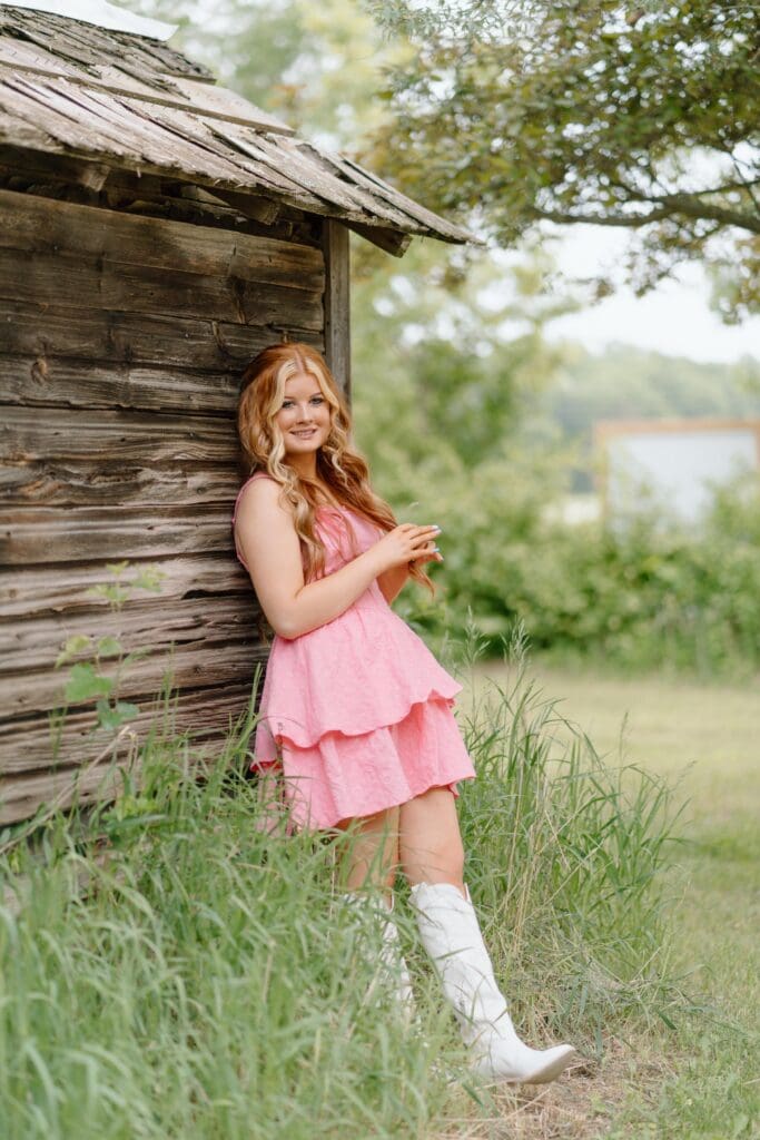 Close-up of a high school senior in blush pink dress and natural makeup